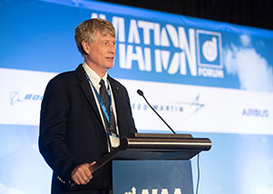 Dr. Stewart Glegg speaking on a podium