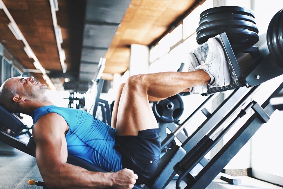 Student on the squat machine