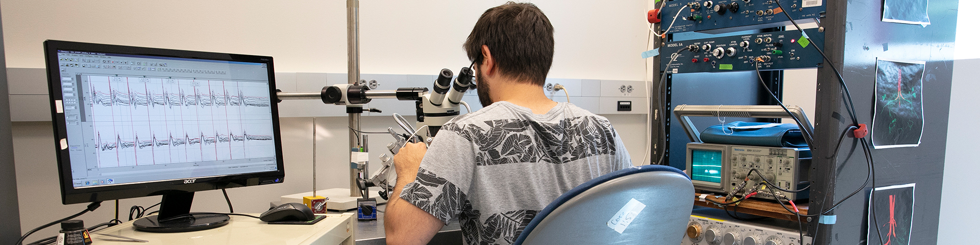 Student looking into a microscope