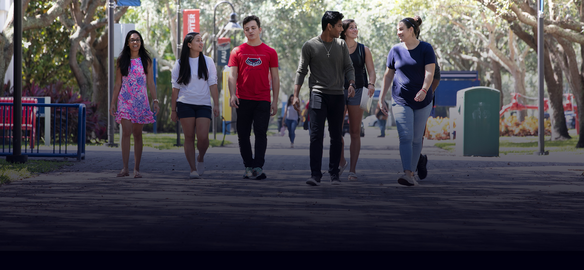 students walking on campus sidewalk