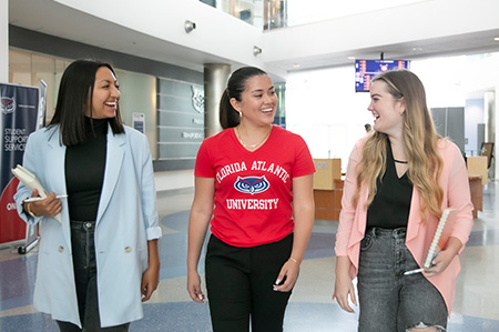 Students walking in Student Support Services building