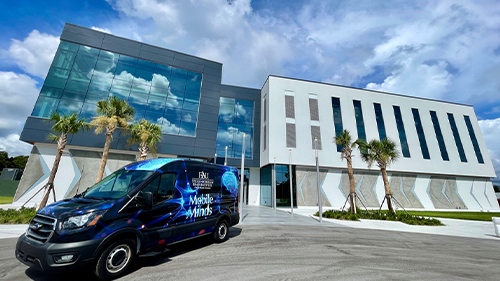 new building with van in front