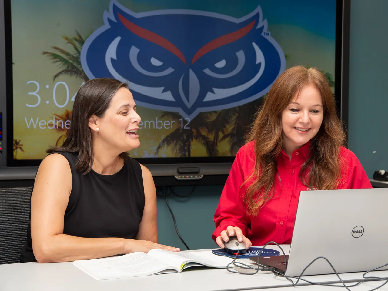 one faculty sitting next to an instructional designer